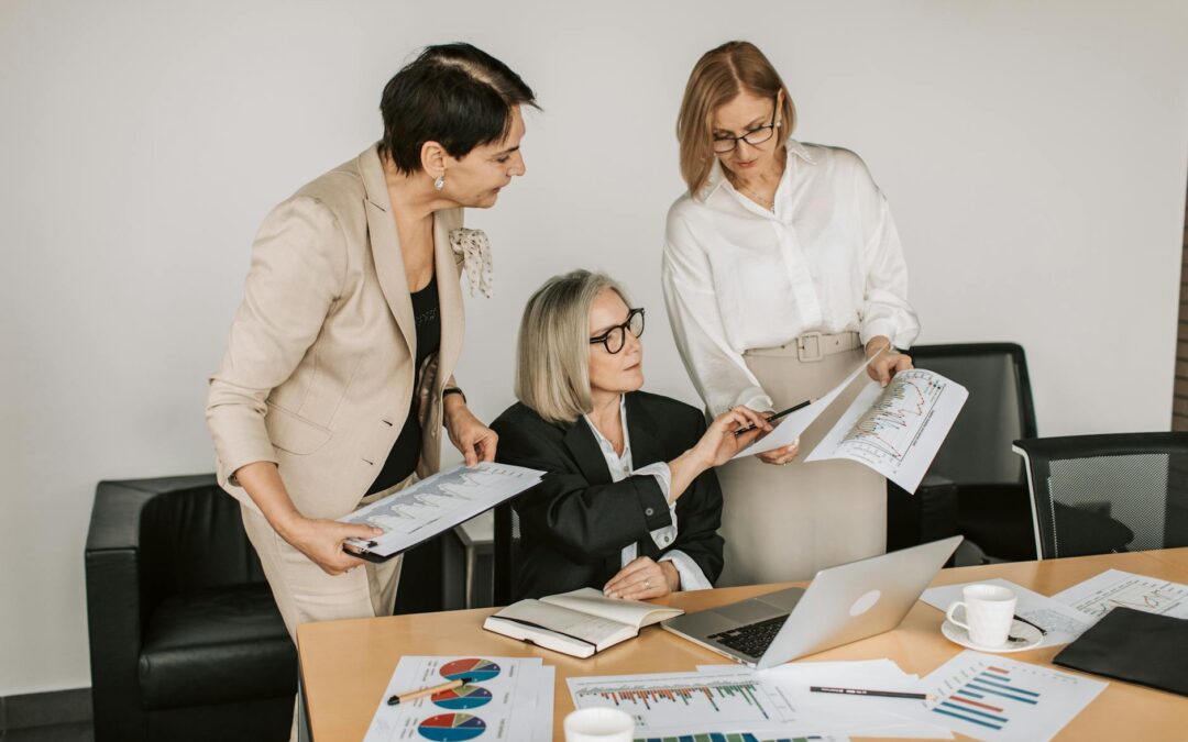 three women having a meeting at the office