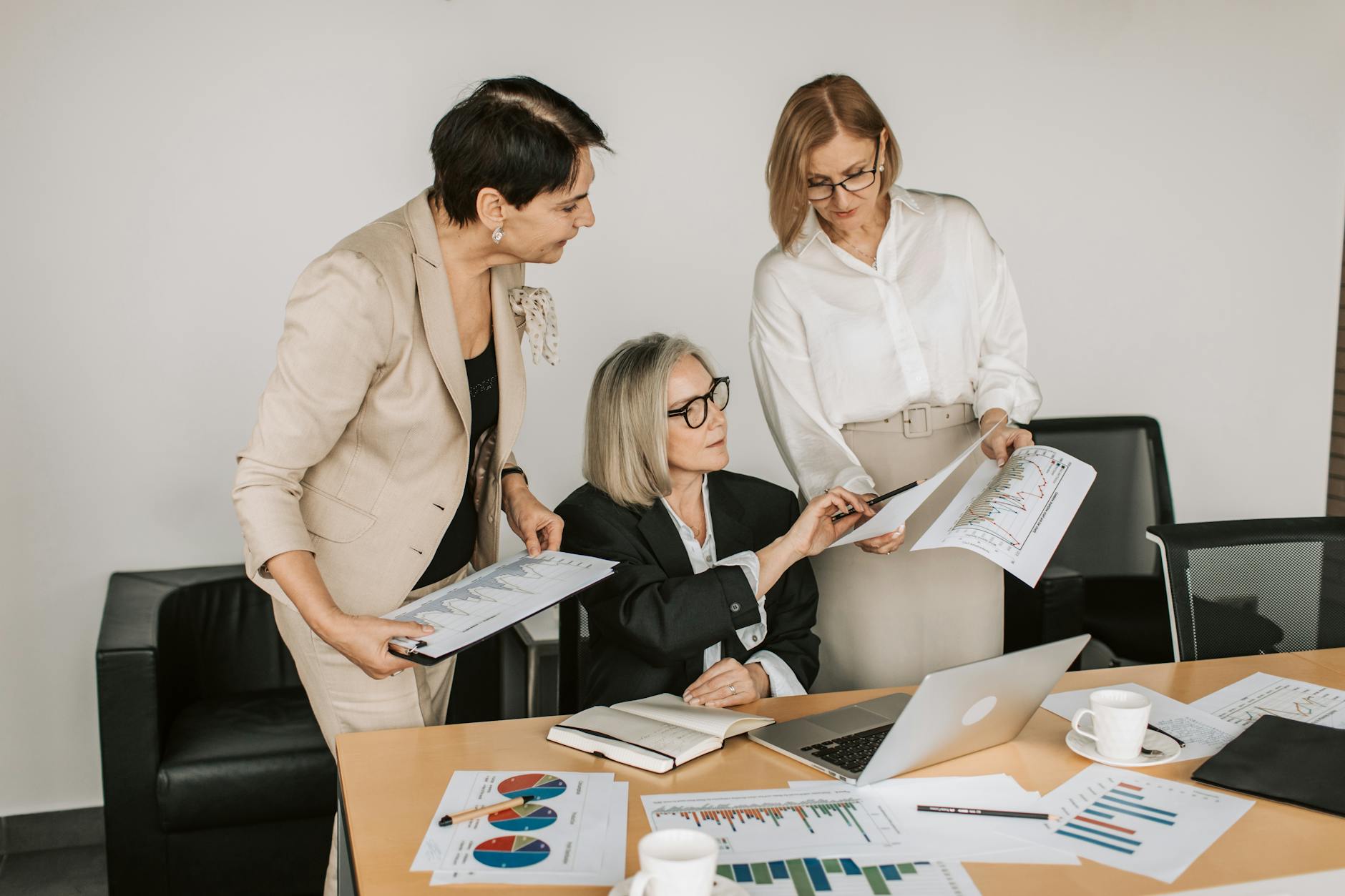 three women having a meeting at the office